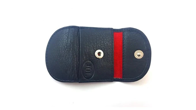 The Himber Coin Purse by Jerry O'Connell and PropDog shown partially open against a white background