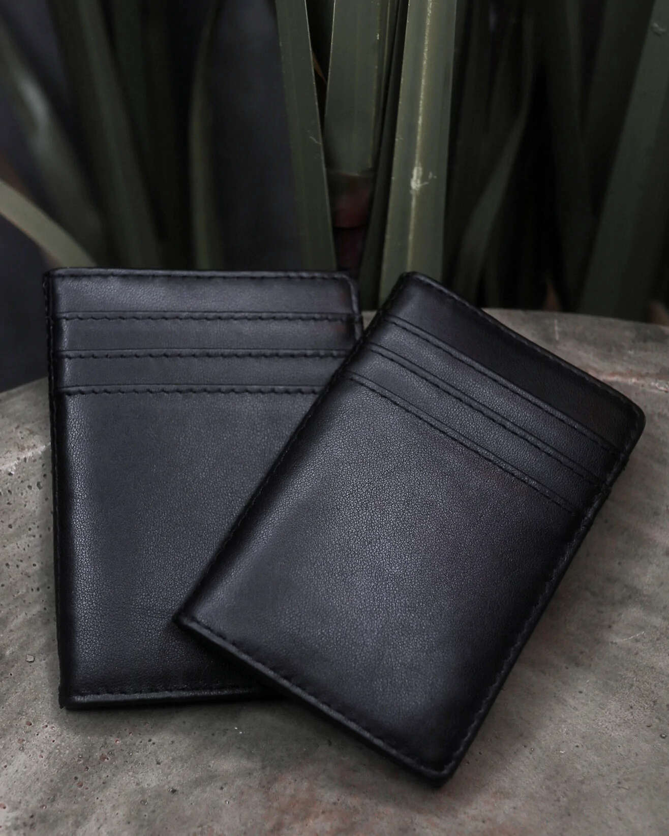 Orphic by The 1914 and Lewis Le Val on top of Orphic Plus Wallet on grey background