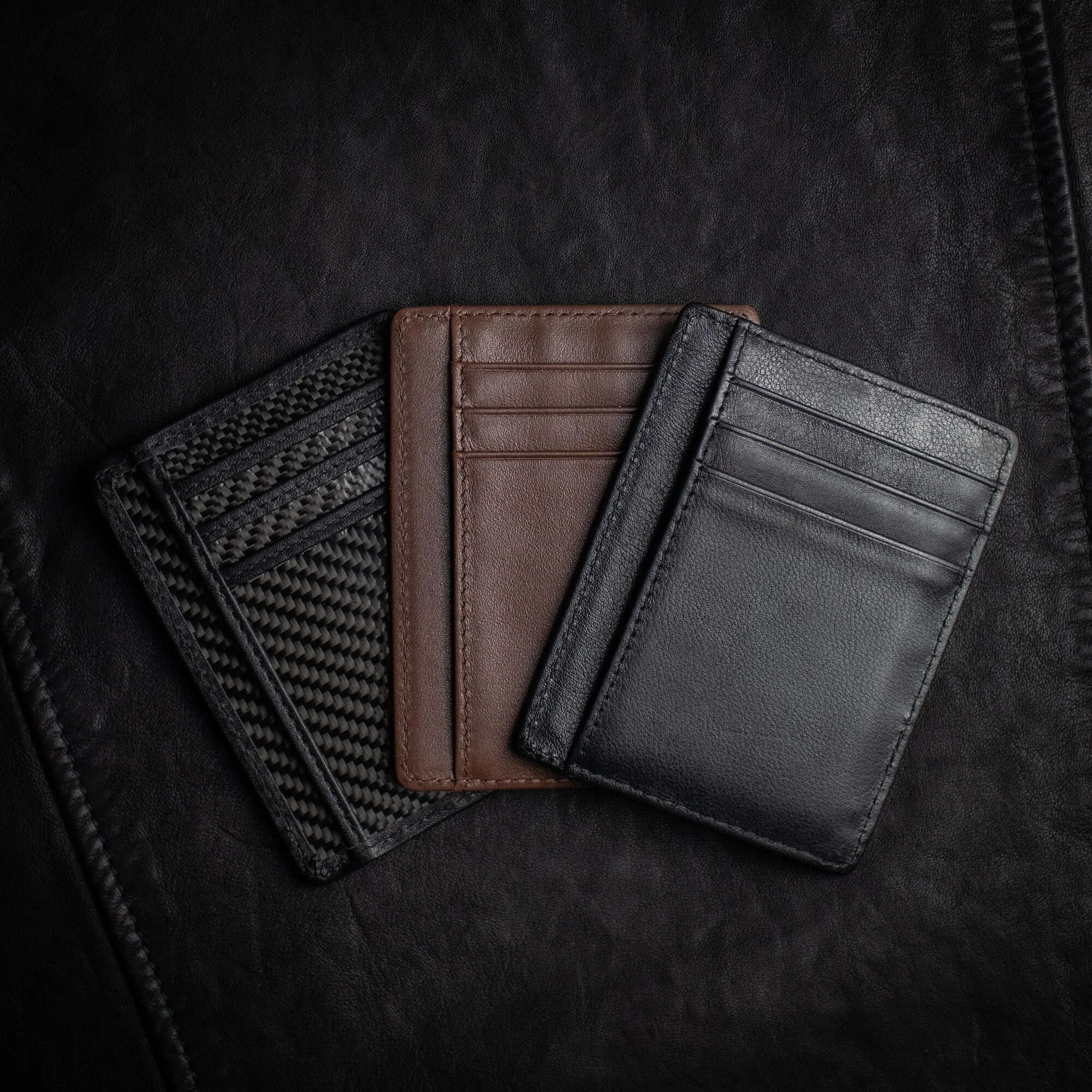 All versions of Shadow Wallet by Dee Christopher on black surface