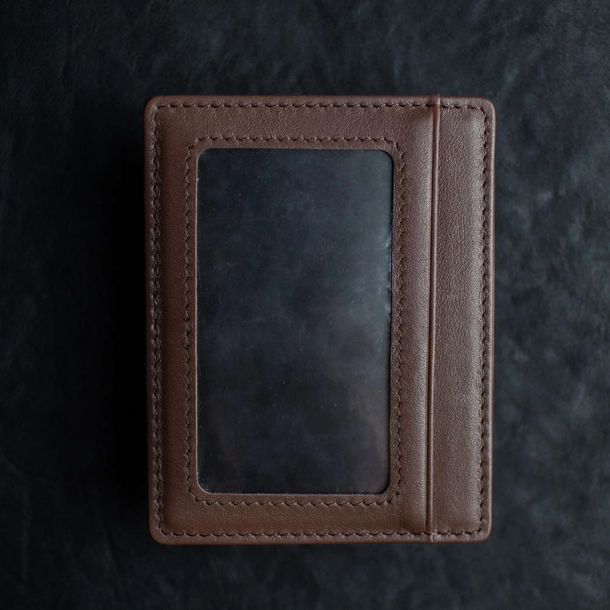 Brown Shadow Wallet by Dee Christopher on black surface showing ID Window