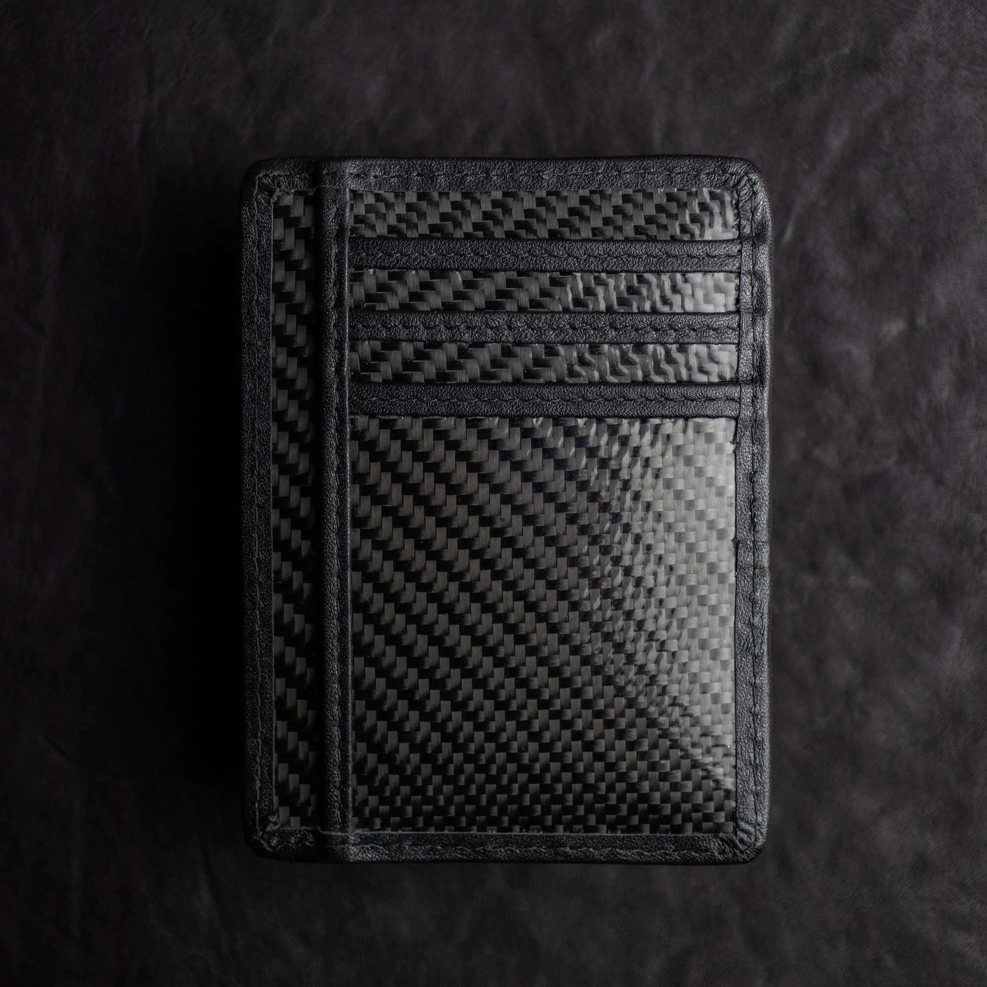 Alternate Version Black Shadow Wallet by Dee Christopher on black surface (back view)