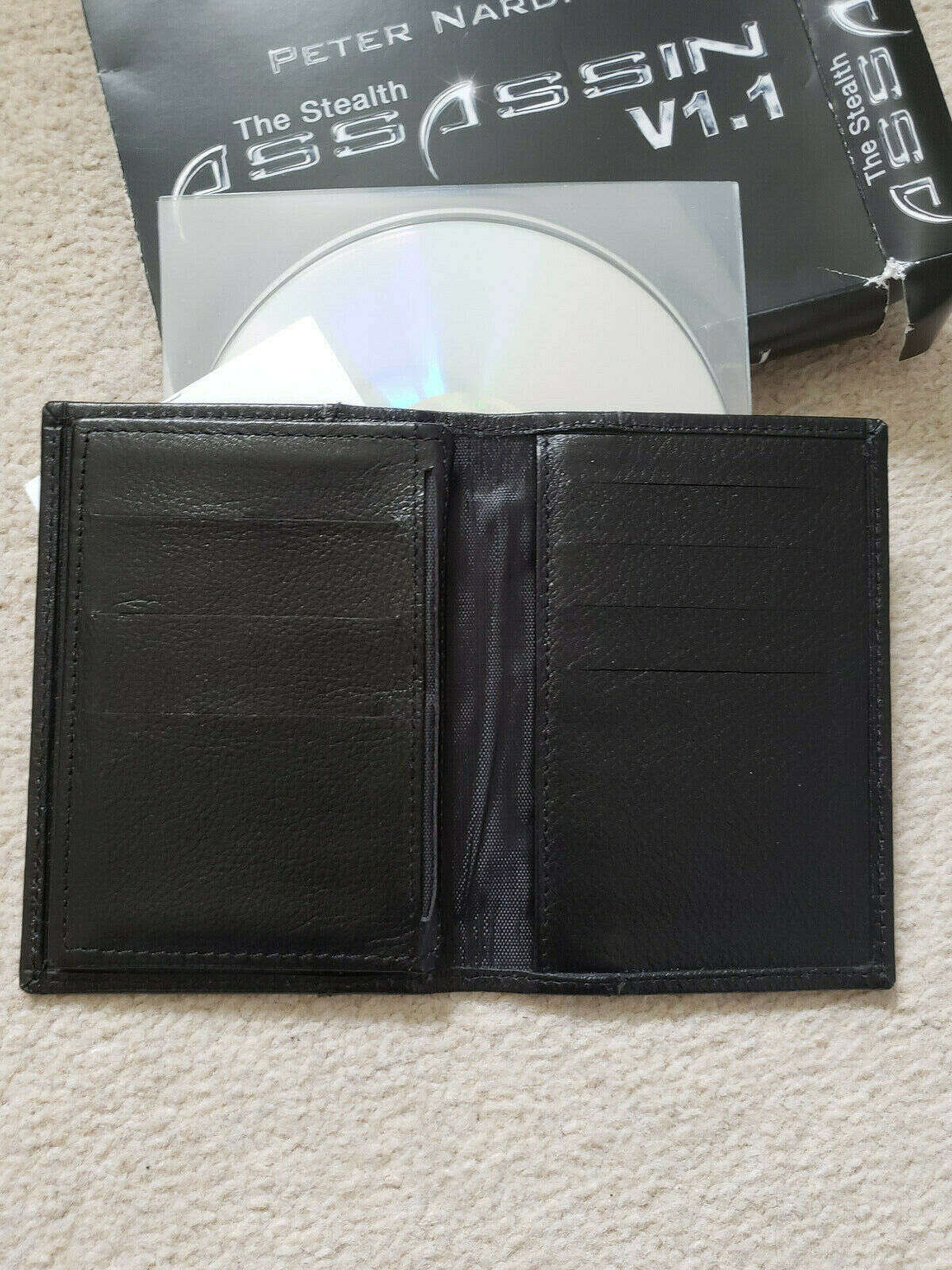 Stealth Assassin Wallet (V1.1) by Peter Nardi and Marc Spelmann black shown open with DVD and box underneath