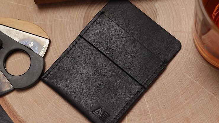 Wallet by Nicholas Lawrence next to cigar cutter