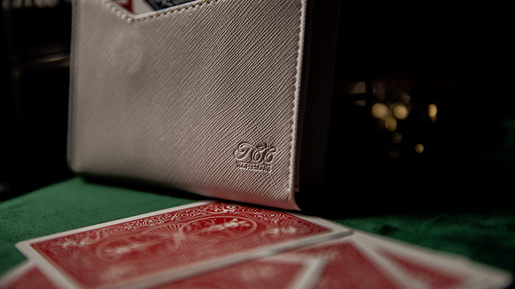Luxury Leather Playing Card Carrier by TCC on green surface next to several red playing card